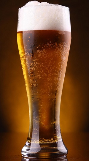Tall glass of light craft beer