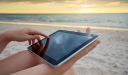 Woman using a tablet on Costa Rica beach